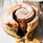 a gluten free cinnamon roll on a plate