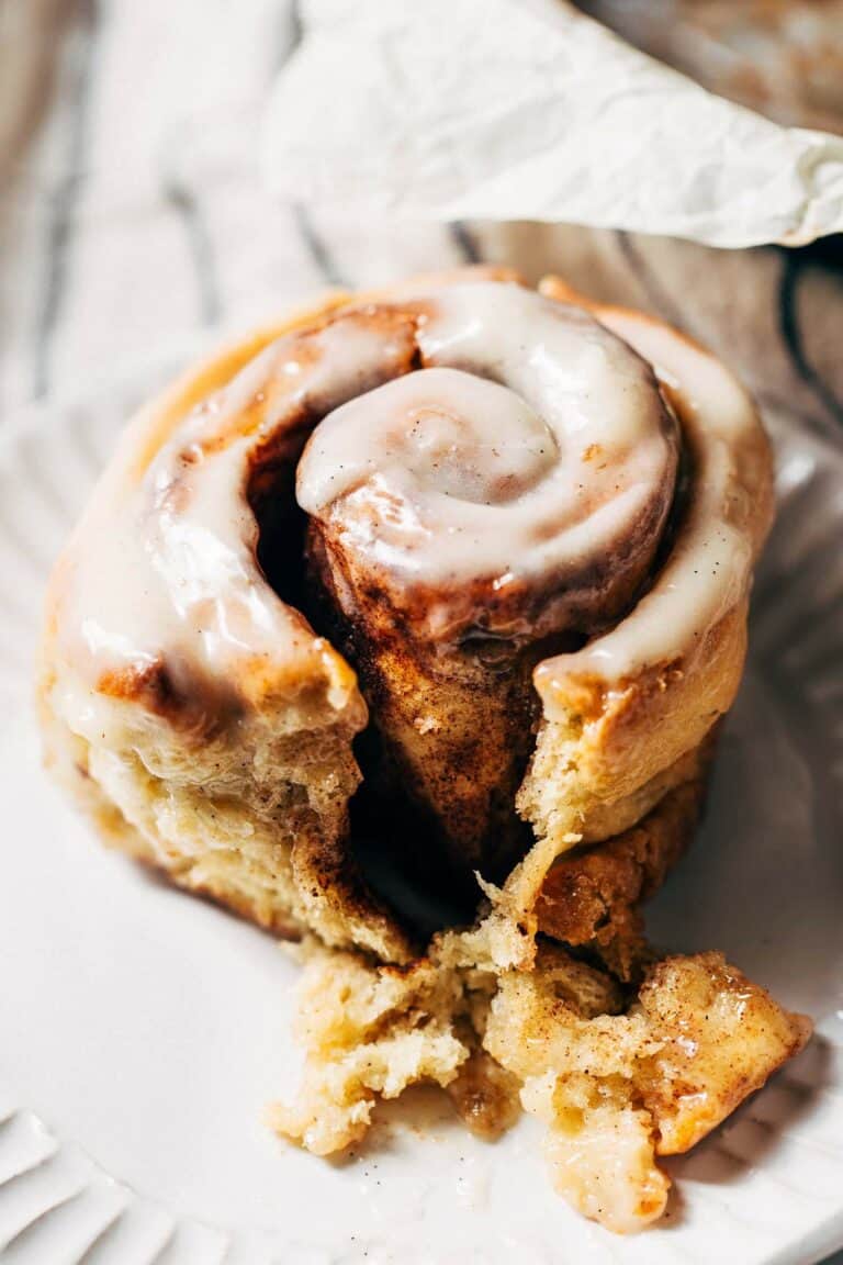 a gluten free cinnamon roll on a plate