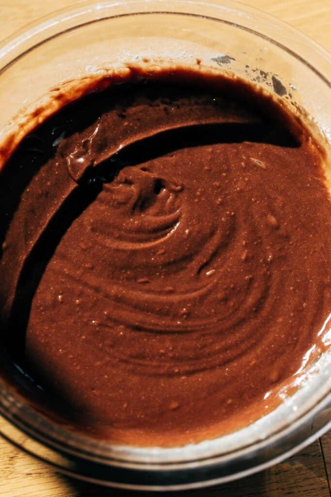 a bowl of brownie cake batter