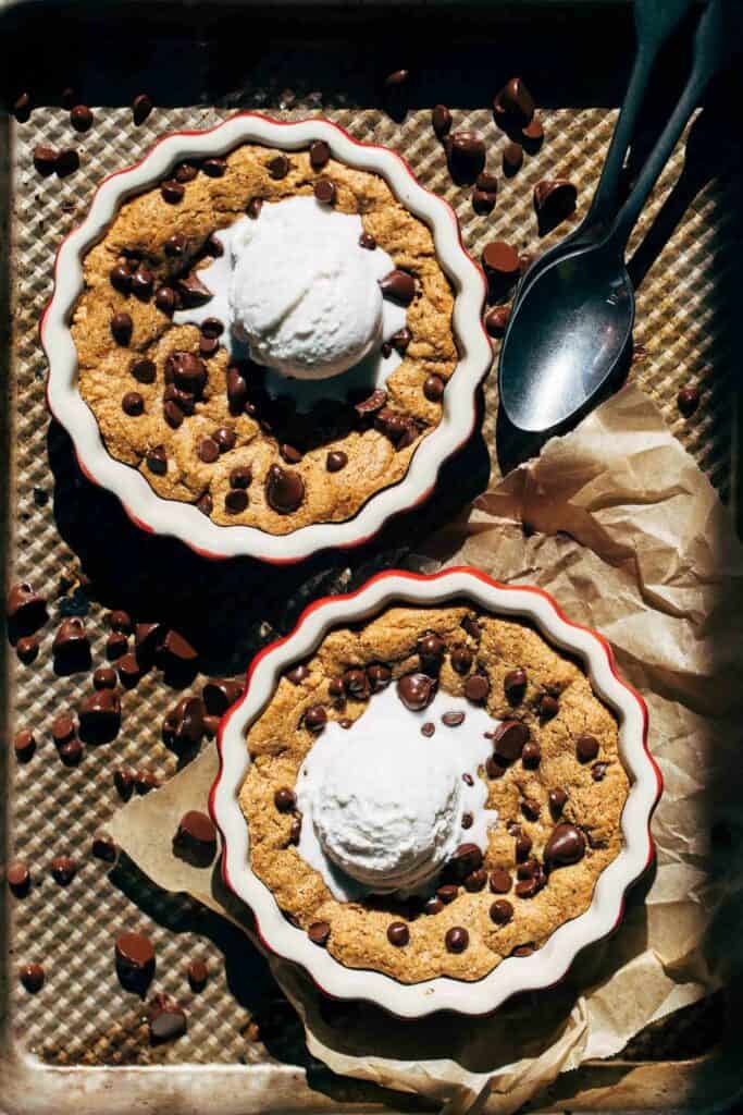 two skillet cookies on a baking tray