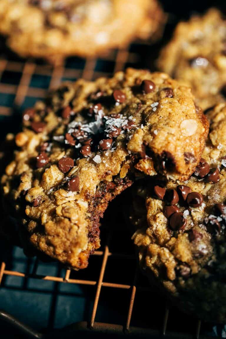 a bite taken from an oatmeal chocolate chip cookie