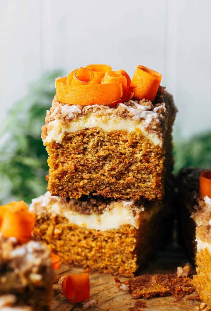 two slices of carrot coffee cake stacked on top of each other