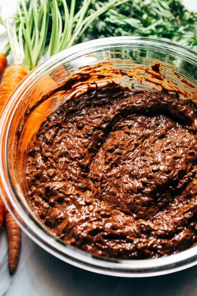 a bowl of chocolate carrot cake batter