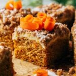 close up on a slice of carrot coffee cake baked with a layer of cream cheese