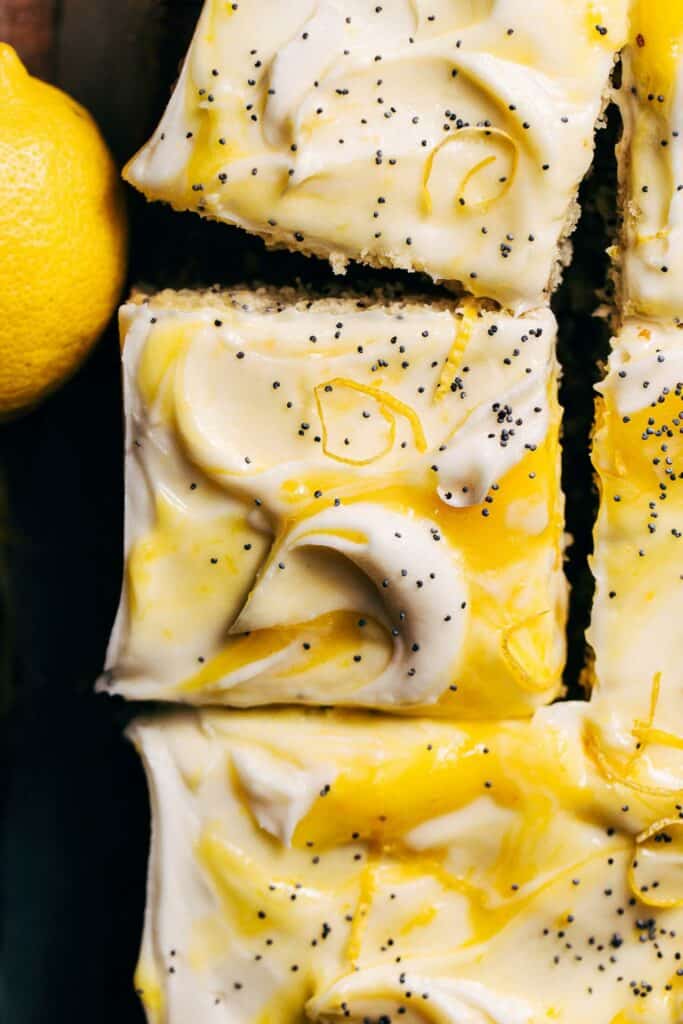 the top of a frosted lemon poppy seed cake slice