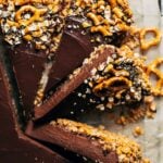 close up on slices of chocolate tart with a pretzel crust