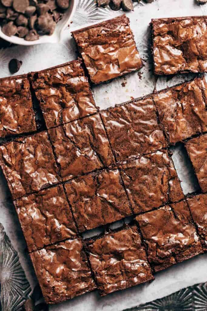 the top of sliced gluten free brownies with a glossy paper thin top