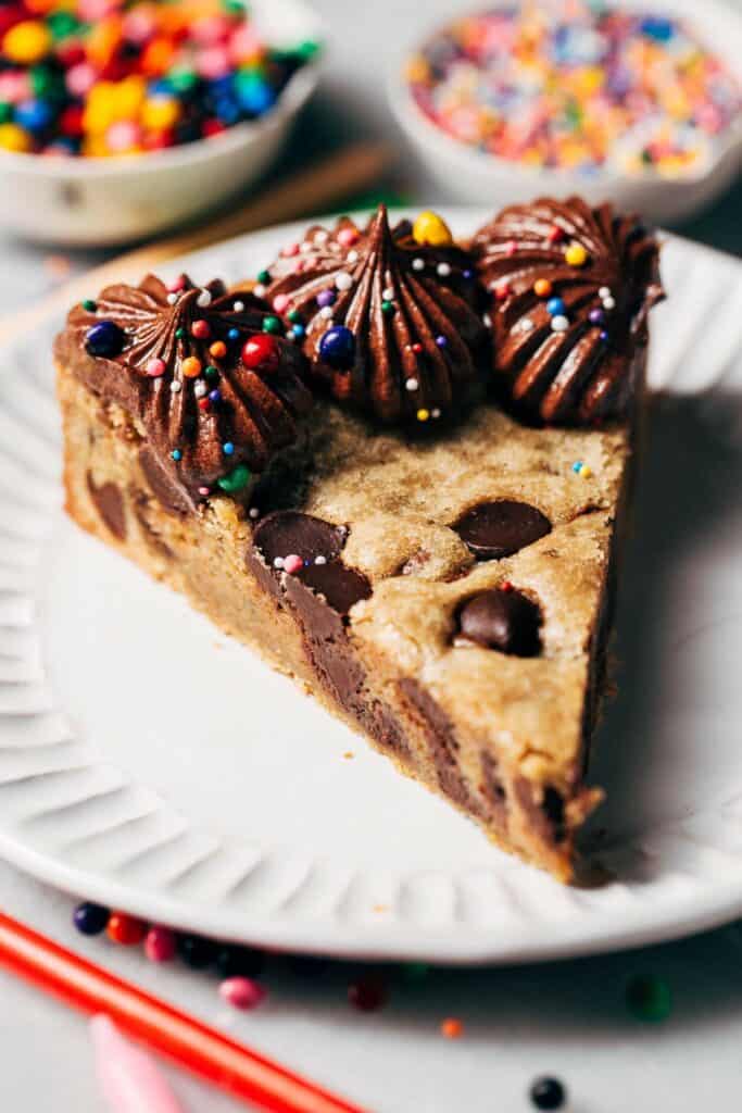 a slice of buttery chocolate chip cookie cake