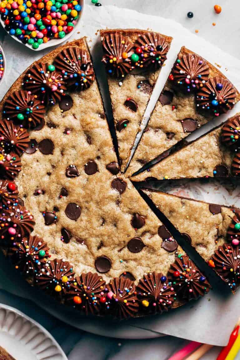 close up on the top of a sliced chocolate chip cookie cake