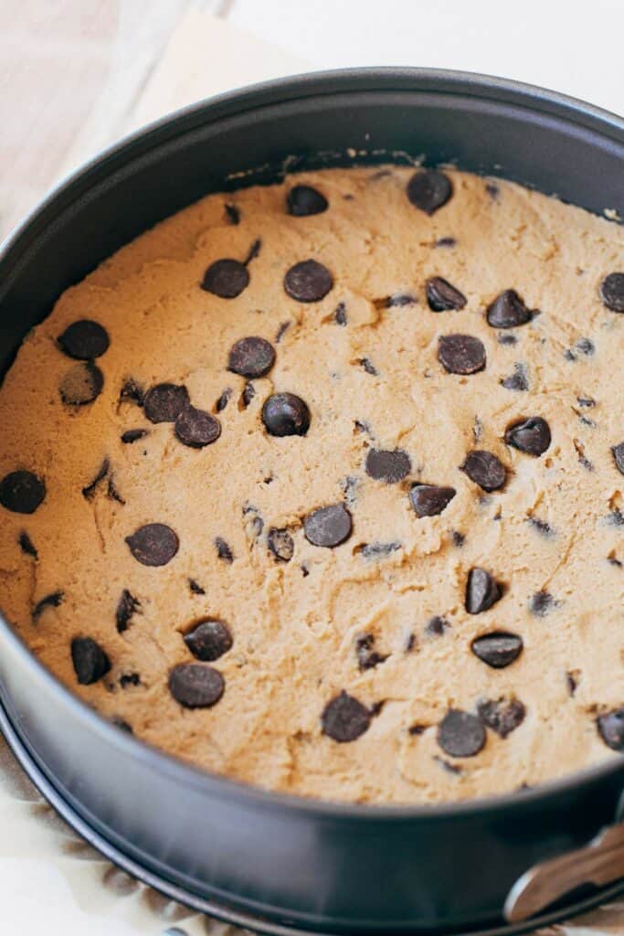 chocolate chip cookie dough spread in a springform pan