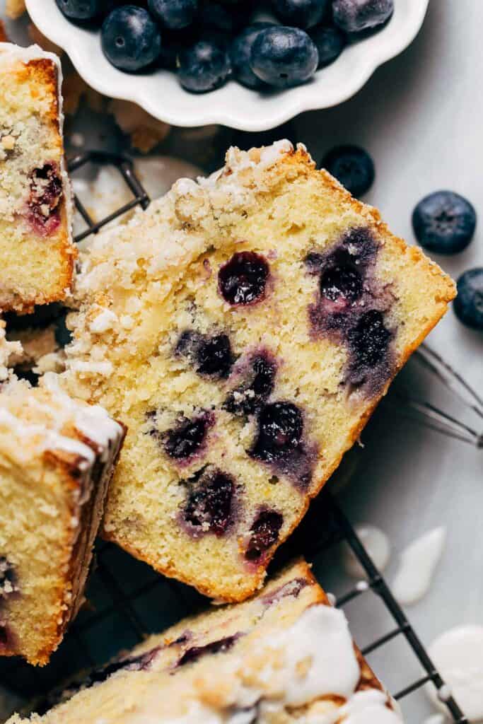 close up on a slice of blueberry lemon loaf