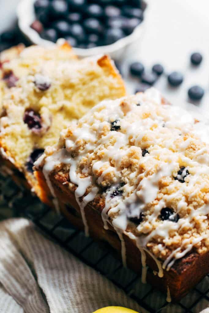 lemon blueberry loaf topped with crumble and icing