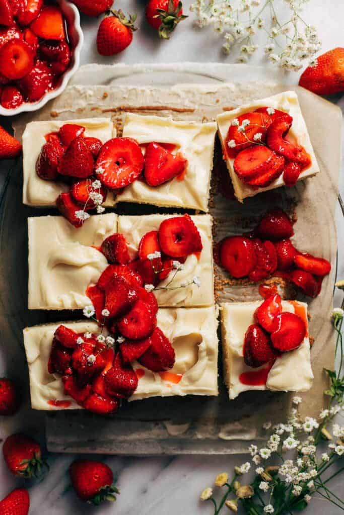 the top of sliced strawberry shortcake cheesecake bars