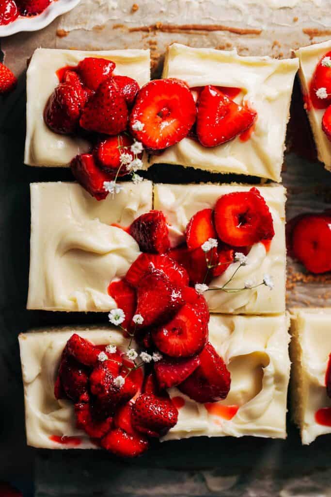 the top of sliced strawberry shortcake cheesecake bars