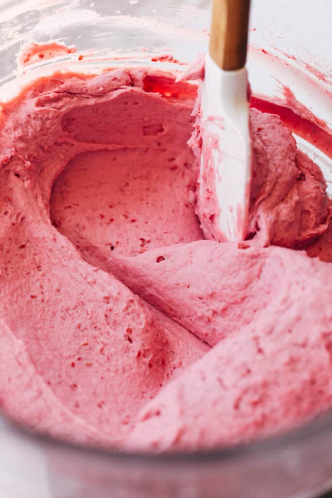a bowl of whipped raspberry frosting