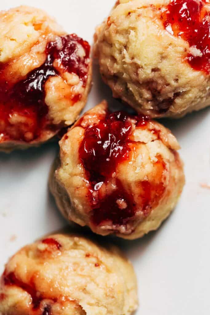 a sugar cookie dough ball swirled with strawberry jam