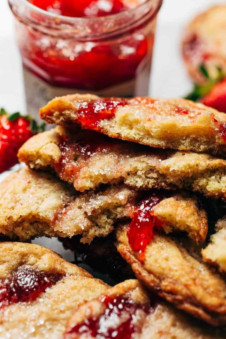 a stack of sugar cookies swirled with strawberry jam