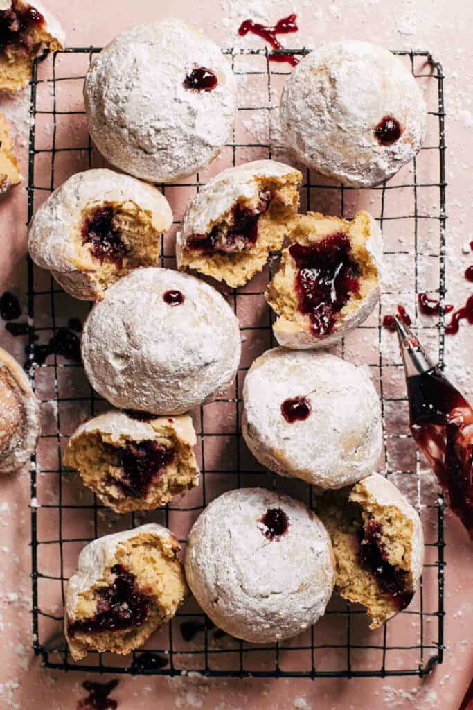 jelly donut muffins on a cooling rack