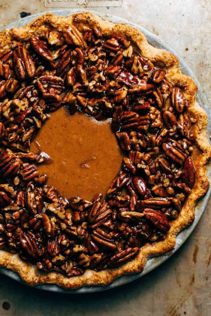 pumpkin pie filling topped with candied pecans