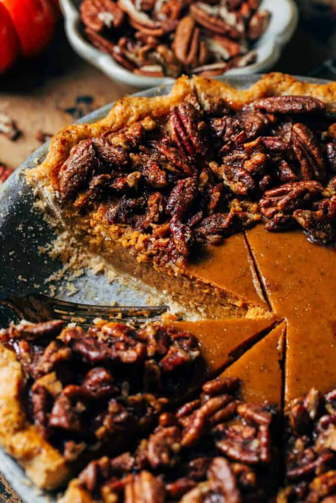 inside a sliced pumpkin pecan pie