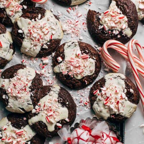 peppermint cookies scattered on a baking pan