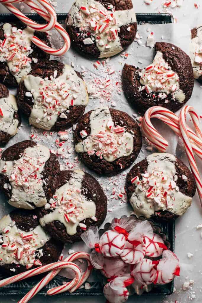 peppermint cookies scattered on a baking pan