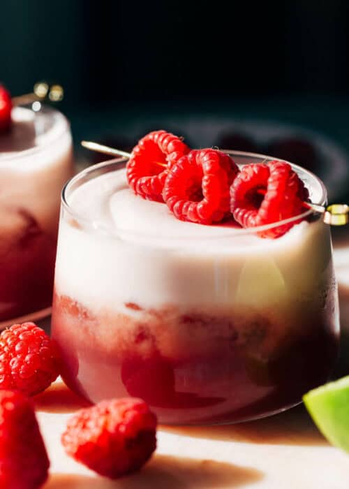 a raspberry mocktail with a frothy top
