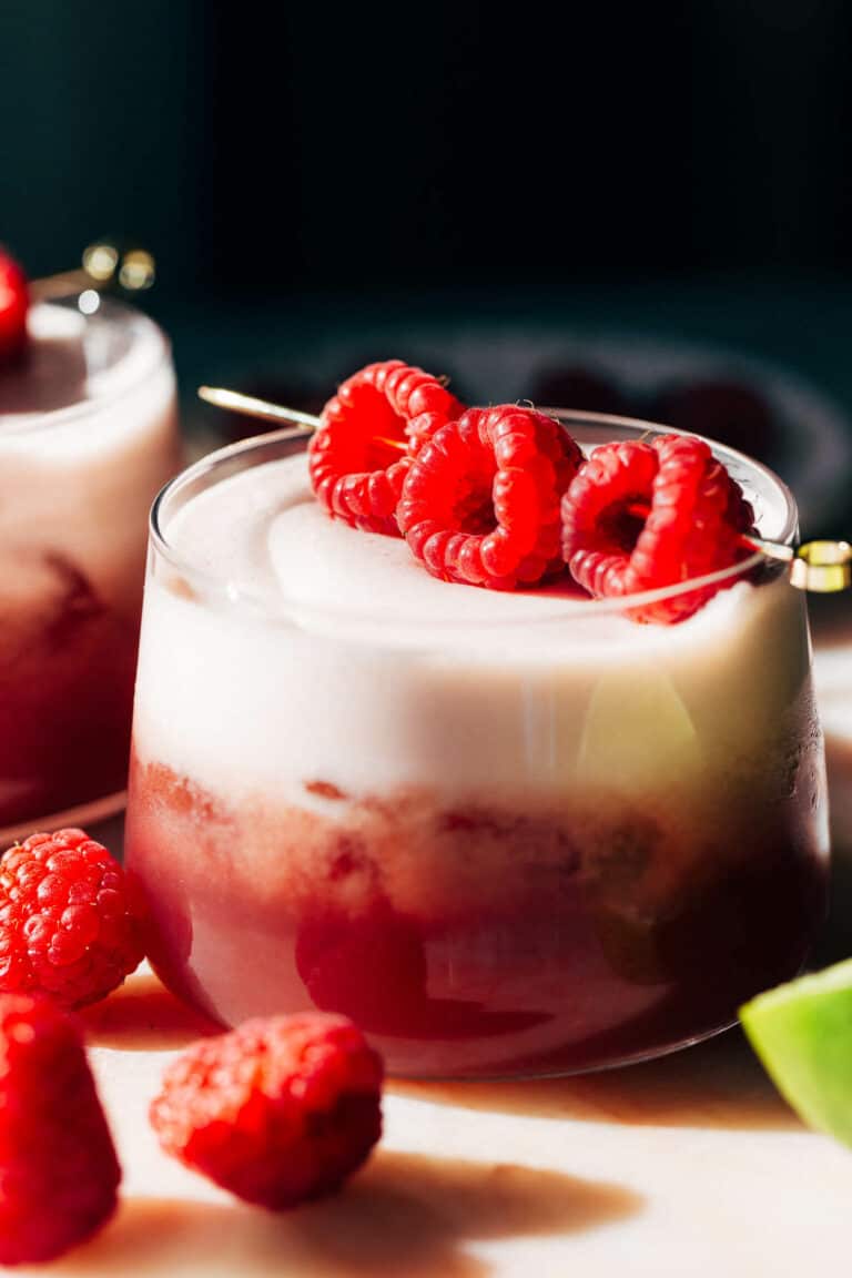 a raspberry mocktail with a frothy top