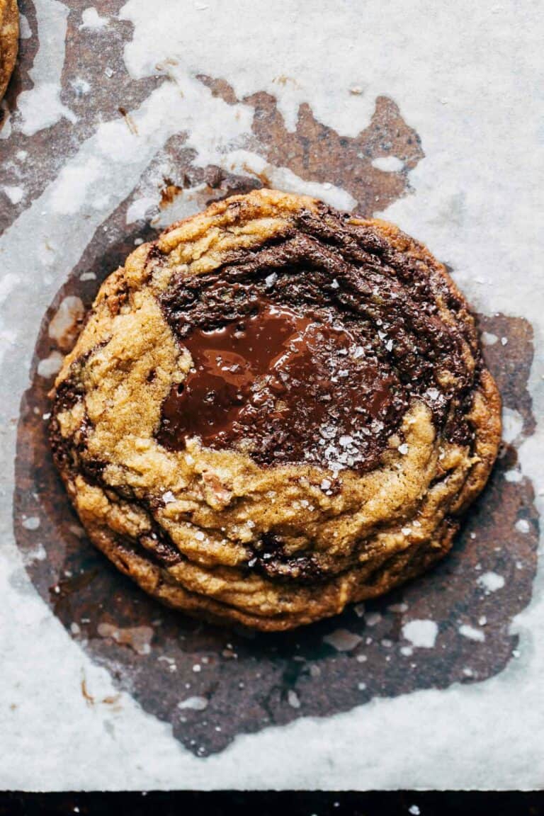 melty brown butter chocolate chip cookie on a baking sheet