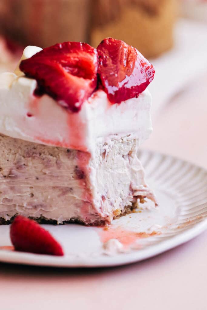 close up on strawberry cheesecake slice