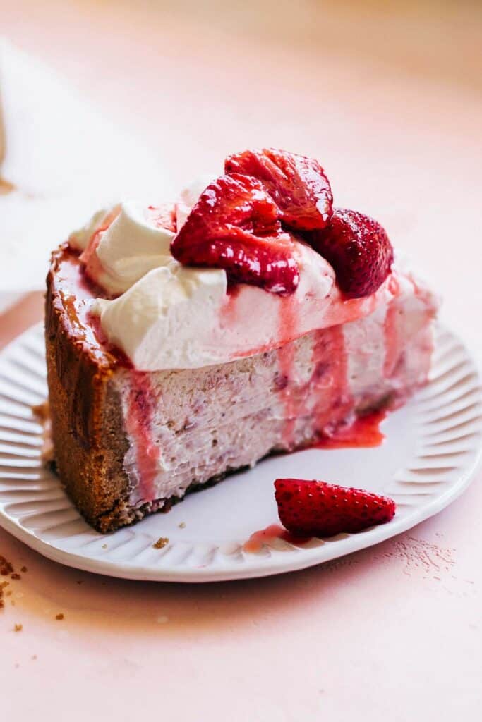 strawberry cheesecake slice topped with roasted strawberries