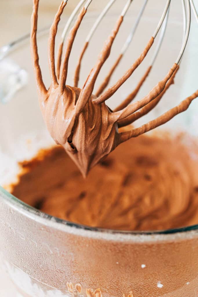 close up of whipped chocolate mousse on a whisk