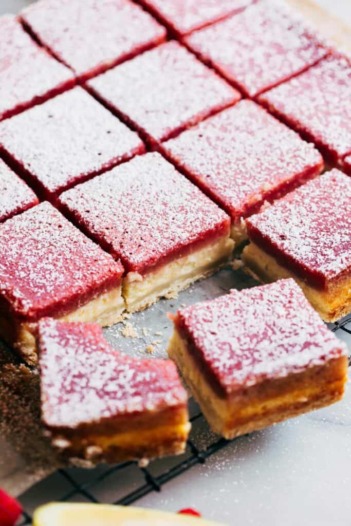 raspberry lemon cheesecake sliced into bars