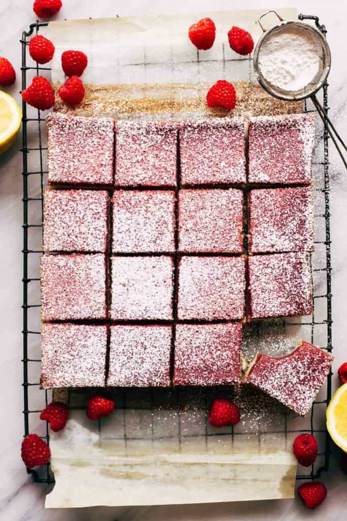 overhead shot of raspberry lemon cheesecake sliced into bars