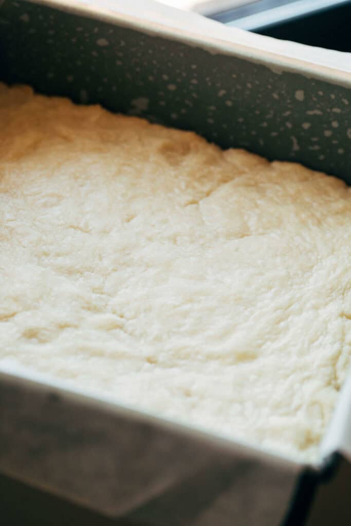 process shot of freshly baked shortbread crust in a pan