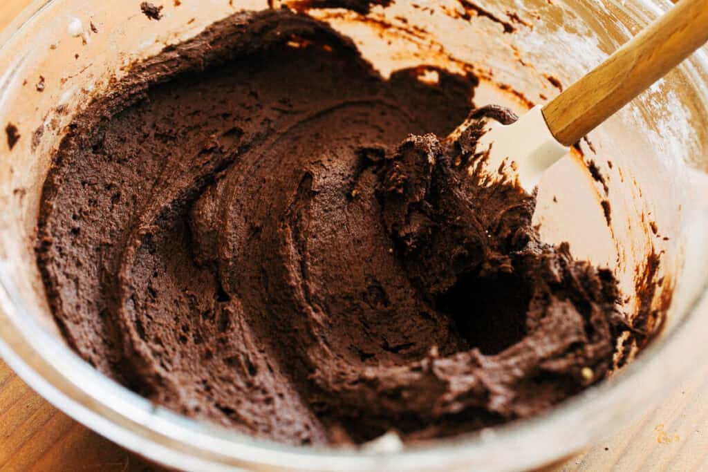 process shot of mixing bowl full of chocolate shortbread dough