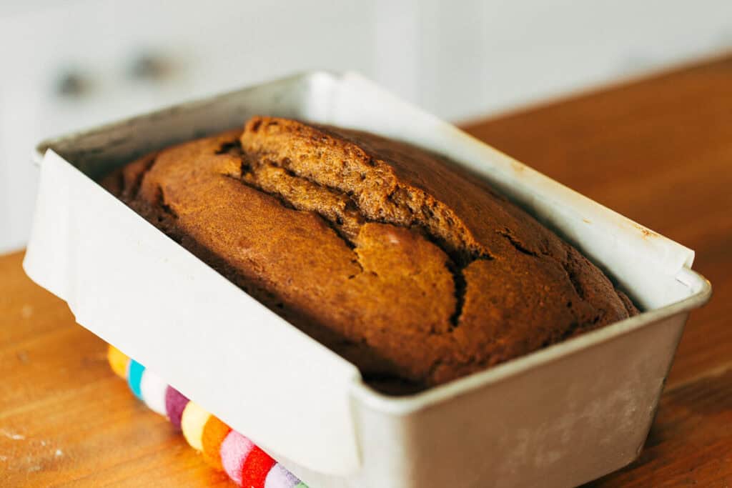 baked pumpkin bread loaf in a pan