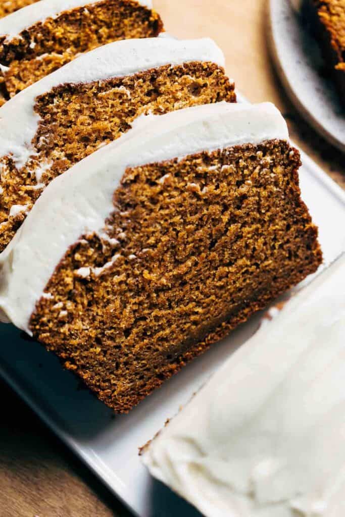 slices of cream cheese frosted pumpkin bread