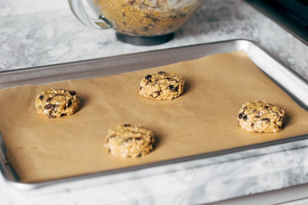 oatmeal raisin cookie dough on a baking sheet