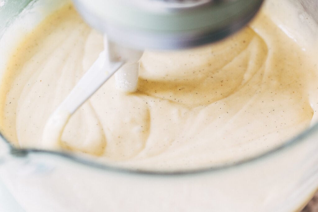 process shot of vanilla cake batter in mixing bowl