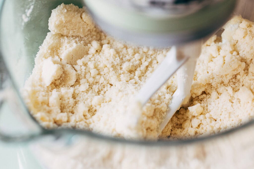 process shot of vanilla cake batter reverse creaming method in mixing bowl