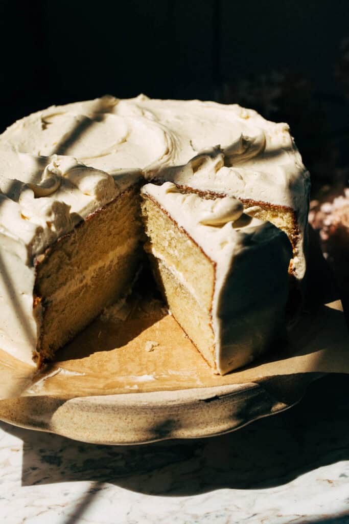 vanilla layer cake with a slice cut out