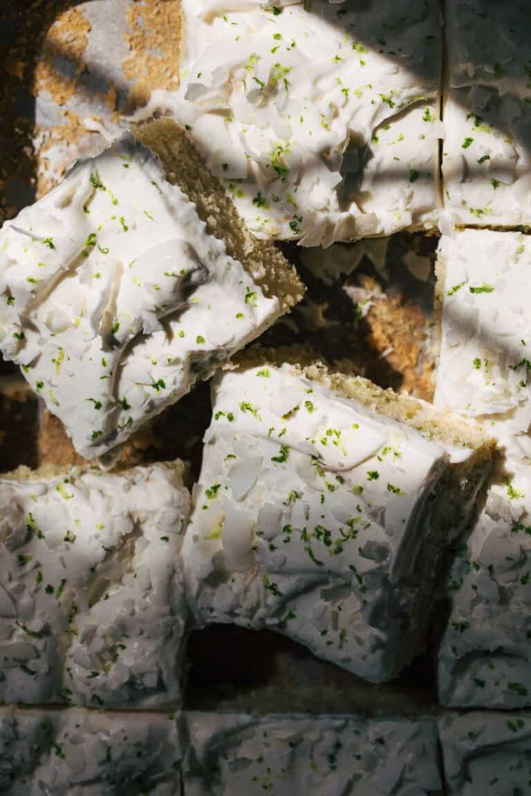 the top of sliced coconut lime sheet cake