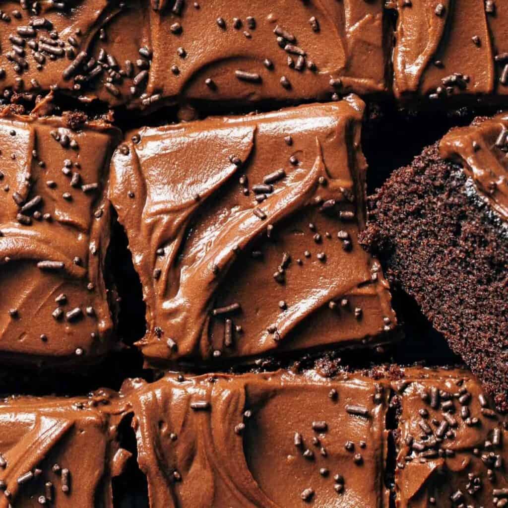 overhead shot of sliced chocolate sheet cake