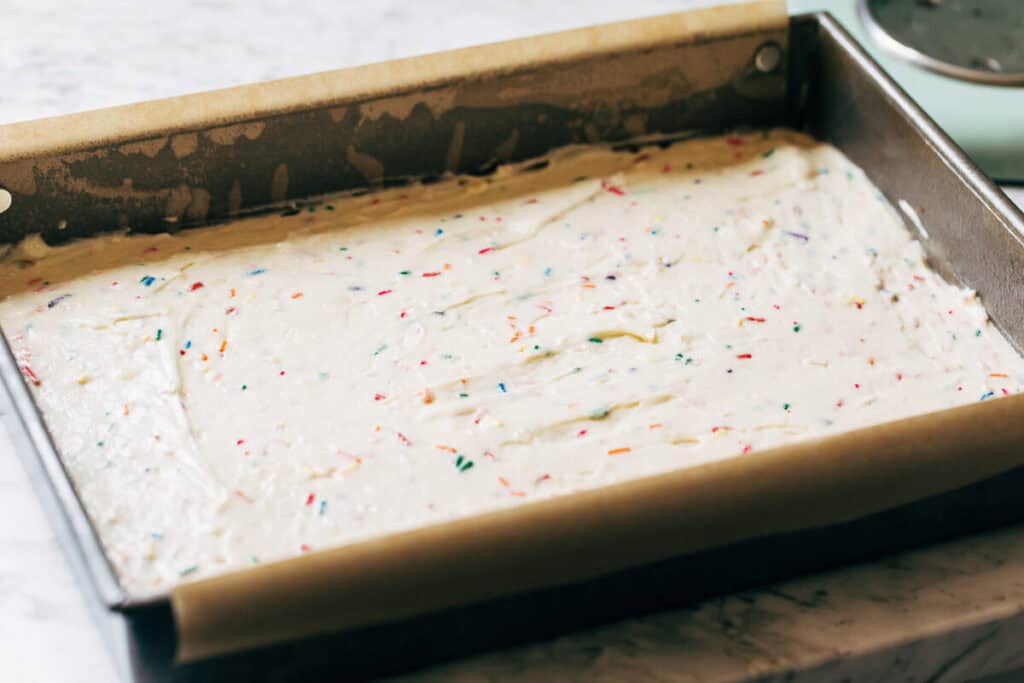 process shot funfetti sheet cake batter in a baking pan