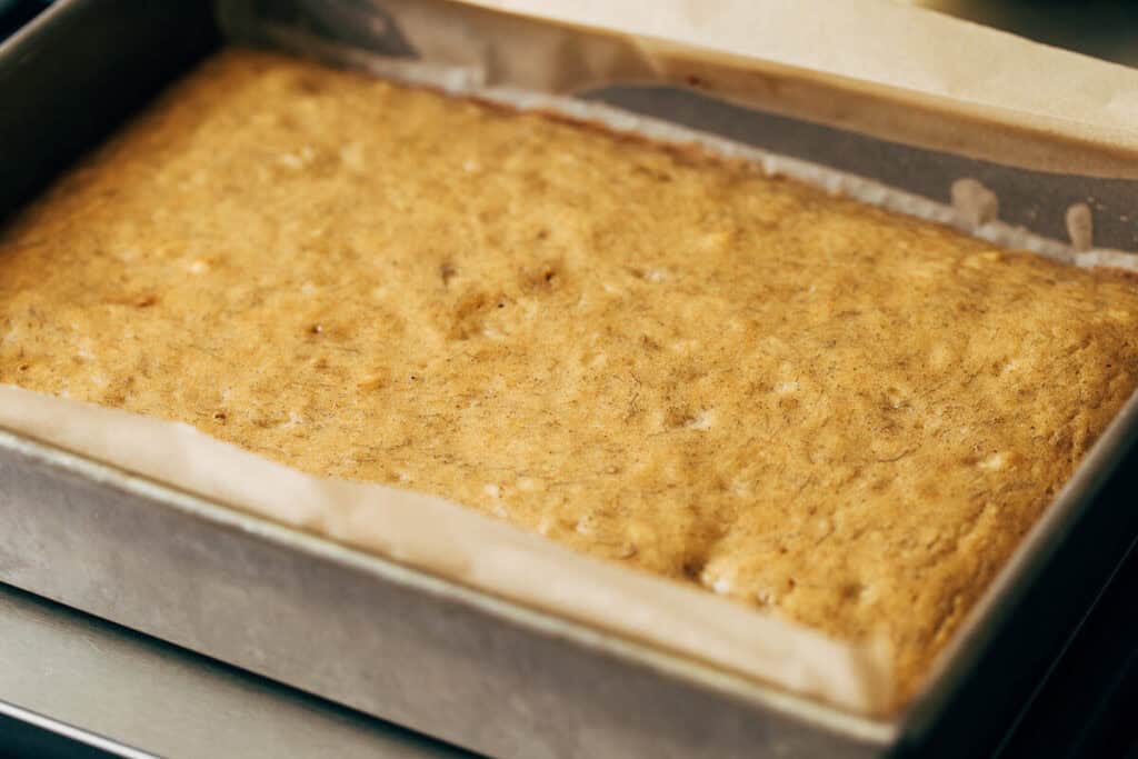 process shot of baked banana sheet can in a pan