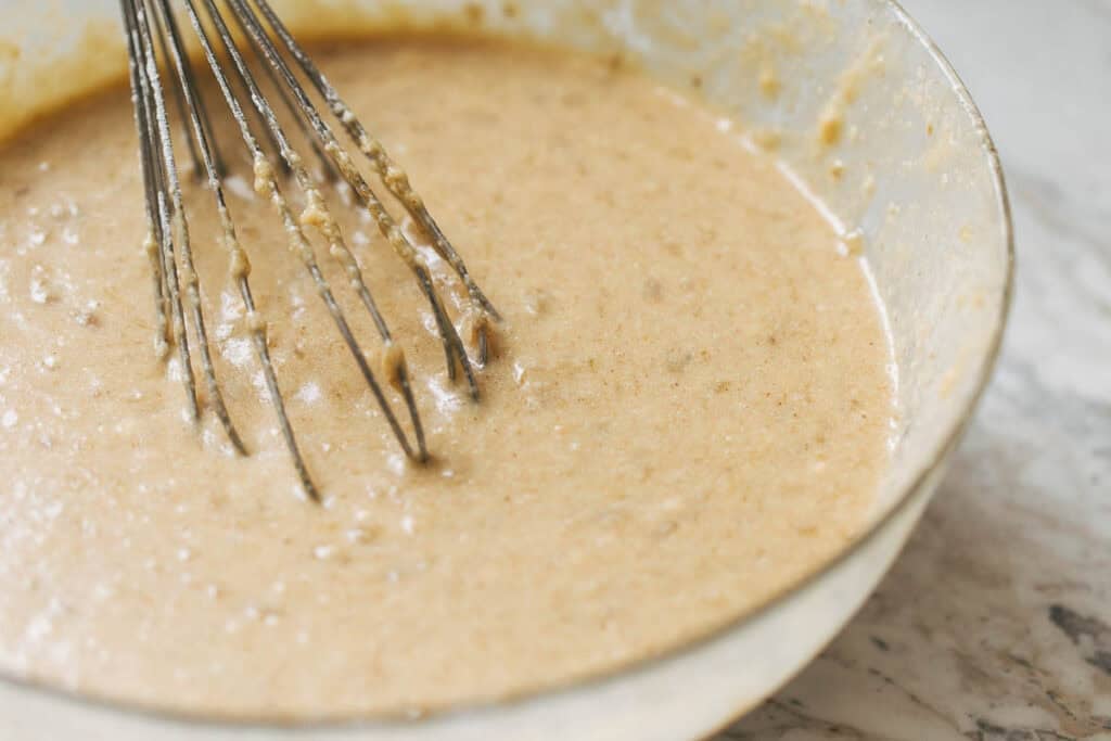 a bowl of banana cake batter