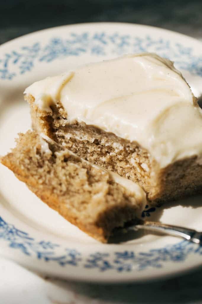 a bite taken from a slice of banana cake