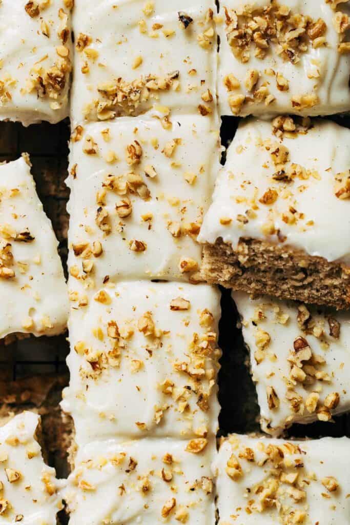 overhead shot of frosted and sliced banana sheet cake