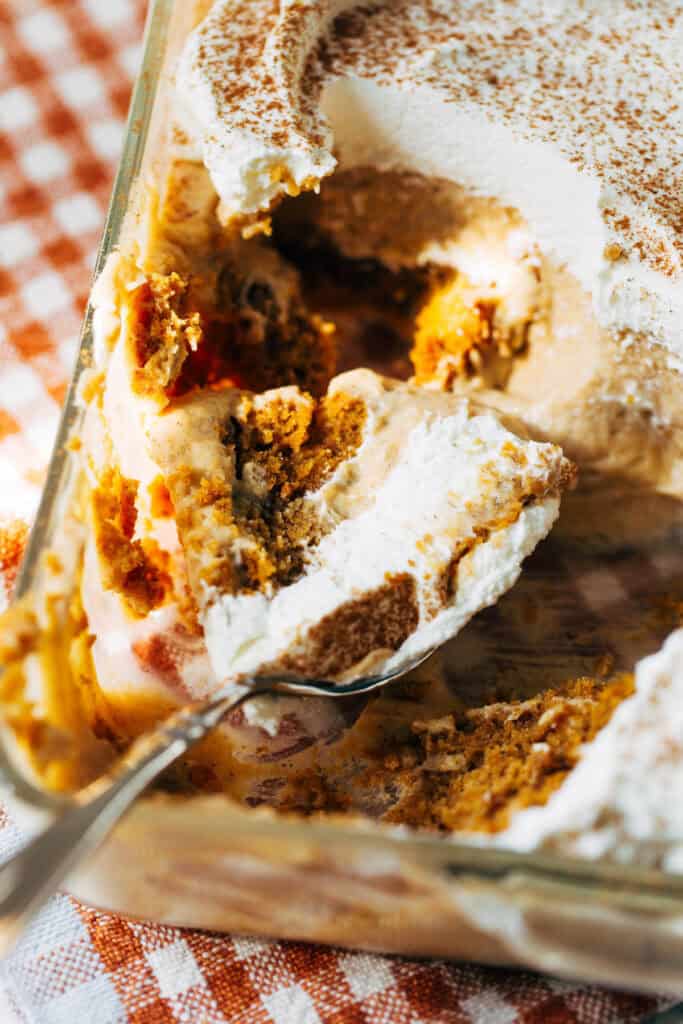 shot of a spoon digging into pumpkin bread pudding